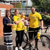 Patrick Grant with wife Lauren and daughter Iris with Friends of the Cancer Centre’s Community Fundraising Officer, Sarah Wilson (left). Pic Credit: Friends of the Cancer Centre