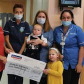 Annje, Zara and Ella McKeag present their amazing £7K cheque to  Nurse in charge Sharon Ferguson, Advanced Neo Natal Nurse Practitioner, Doris Wilson and Neo Natal Nurse, Anna Russell