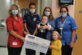 Annje, Zara and Ella McKeag present their amazing £7K cheque to  Nurse in charge Sharon Ferguson, Advanced Neo Natal Nurse Practitioner, Doris Wilson and Neo Natal Nurse, Anna Russell