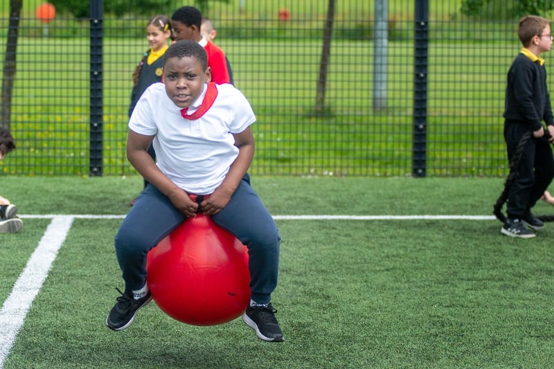 Having fun on a space hopper at the sports event on Wednesday.PT23-254.