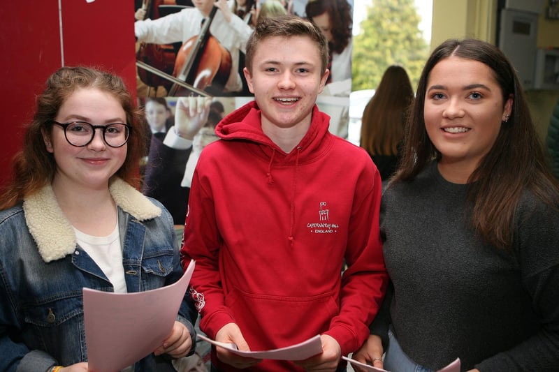 Rebecca Hegarty (7A* 3A), Timothy Moore (5A* 5A), and Ellen White (8A* 2A) on GCSE results day 2018 at Ballyclare High School.