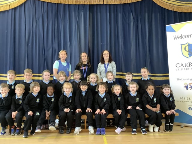 Miss Donaghy's P1 class at Carrick Primary School with classroom assistants Mrs McClure and Miss Sykes.