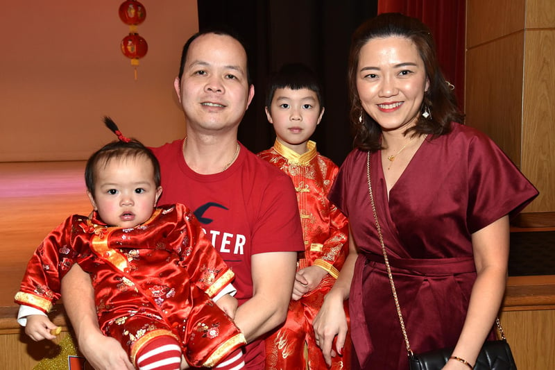 Evey (2) and Harry (4) with mum and dad,  at the Chinese New Year celebrations in Craigavon Civic Centre. PT04-217.