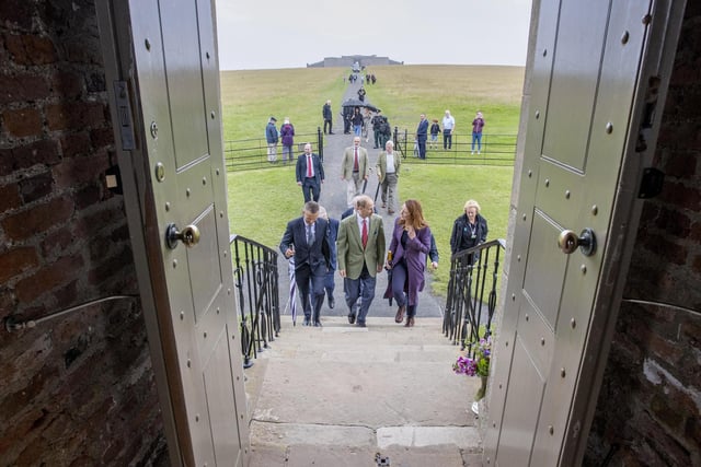 The Duke of Edinburgh approaches Mussenden Temple accompanied by David Jackson, Chief Executive of Causeway Coast and Glens Borough Council, and Heather McLachlan, National Trust Director for Northern Ireland...Pic Steven McAuley/McAuley Multimedia
