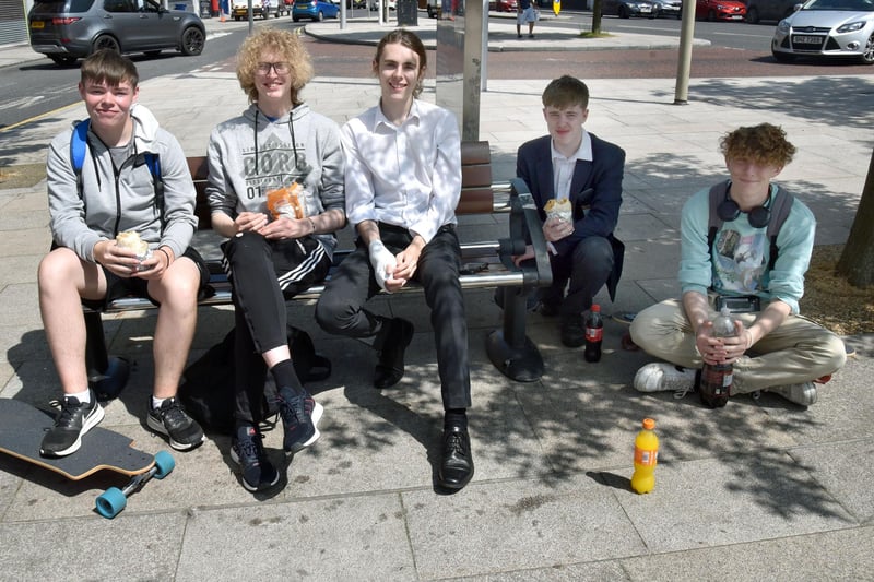 Some young people who found some shade from the scorching sun in Portadown town centre on Wednesday afternoon. PT22-241.