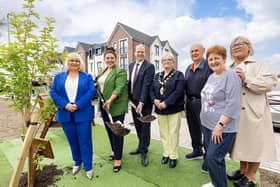 At a tree planting to mark the official opening of new apartments at Mariners Court are: (L-R) Carol McTaggart, chief executive of Clanmil; Maeve Monaghan, chair of Clanmil; Communities Minister Gordon Lyons; the Mayor of Mid and East Antrim, Ald. Beth Adger, MBE; Samuel and Frances McClure; Janice Hill, Carrickfergus Community Forum. Photo submitted.