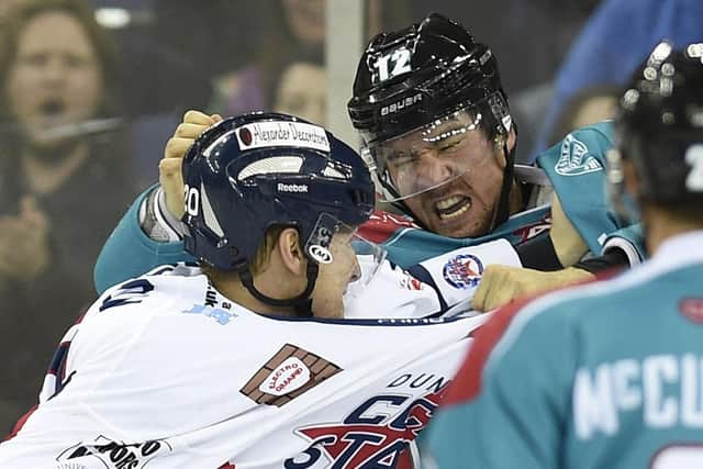 Ray Sawada of the Belfast Giants fights Brad Plumpton of the Dundee Stars during 7-1 win in the Elite League game at the Odyssey Arena, Belfast in 2014. Picture: Michael Cooper