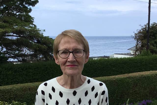 Libby Magill who has wet AMD, pictured outside her home in Ballygally with views out to the sea