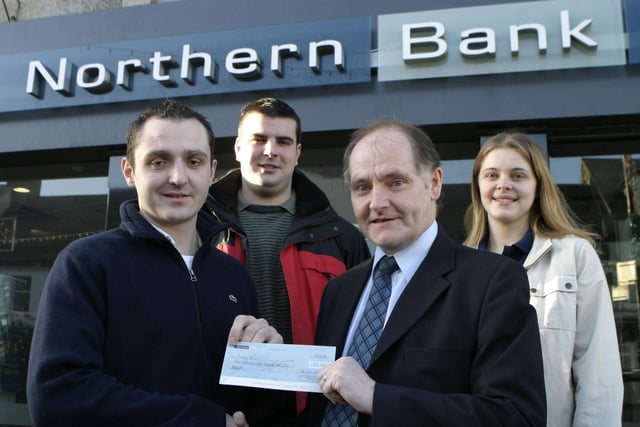 Vincent McCarry, Manager of Northern Bank, Ballymoney, pictured presenting a cheque to Martin Blair from Finvoy YFC in 2007. The local bank are supporting Finvoy through their Community Grant Scheme for a Musical/Drama production to be held later this year. Looking on are club members, Neil McGinley and Stephanie Fulton.