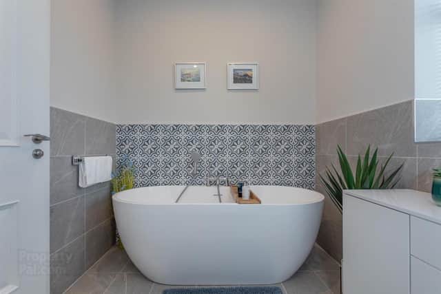 The deluxe family bathroom has a contemporary stand-alone bath.
