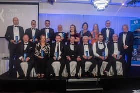 The main prize winners at the 2024 Mid Ulster Business Excellence Awards. Also included are Ian Henry, front centre, of main sponsors Henry Bros. and compere Adrian Logan, back right. Photo: TONY HENDRON