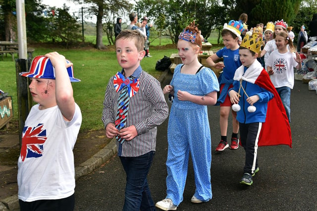 Rain didn't dampen the enthusiasm of Derryhale Primary School when they took part in a 'Royal Procession' at their Coronation Party on Friday afternoon. PT18-201.