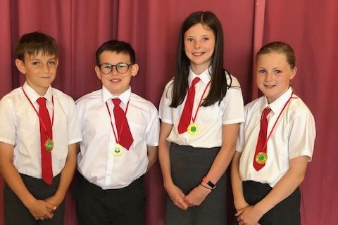 Haydn Ogle, Tyler McCandless, Katie Laird and Natalie Nolan who were named Sports Medallists at the recent prize giving ceremony at Donacloney Primary School.