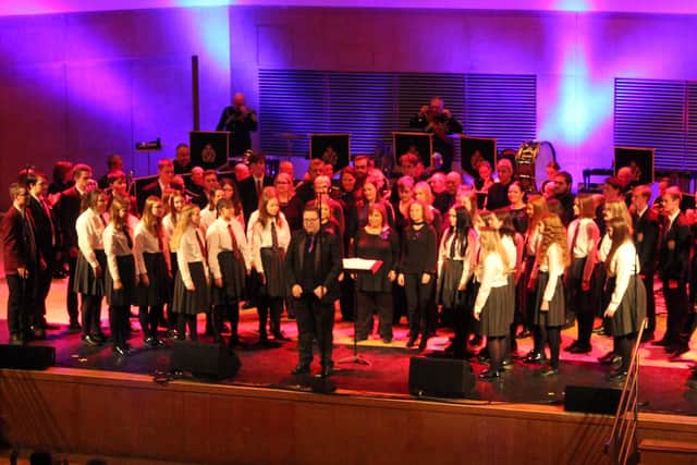 The combined voices of Grosvenor Chorale and Carrickfergus Grammar choirs were heard at the Belfast venue.