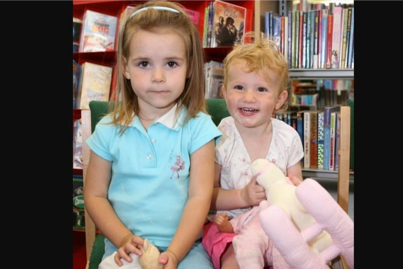 Natasha Nevins and Anna Officer enjoyed story time at Greenisland in 2007.