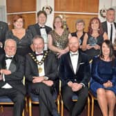 Some of the prizewinners and sponsors at the Carrick Business Excellence awards in 2021 including front row from left, Bob Harper, Lifetime Achievement Award winner, Mayor, Councillor William McCaughey from principal sponsor Mid & East Antrim Borough Council, compere, Barra Best and Jenny Small, VP of Performance and Development Northern Regional College. Also included third, back row, is Kelli McRoberts, manager with category sponsors Carrickfergus Enterprise. Picture: Tony Hendron