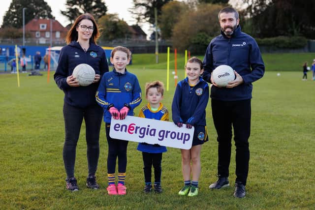 Pictured with three Saint Patrick’s Lisburn Gaelic Club youth team players is club representative Seainin Loughlin and Energia Group employee Tom Martin. Pic credit: Brendan Gallagher