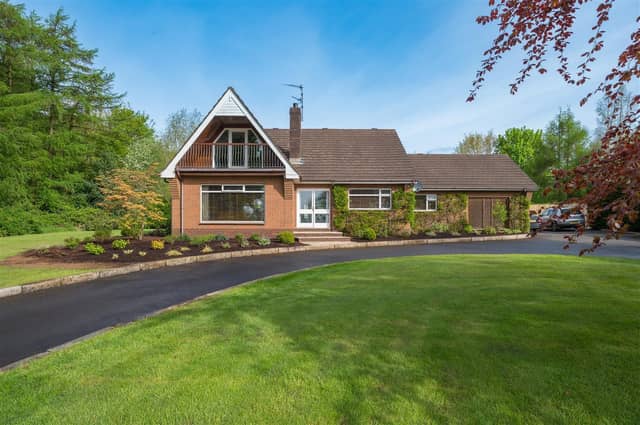 The detached family home occupies a mature, private site.