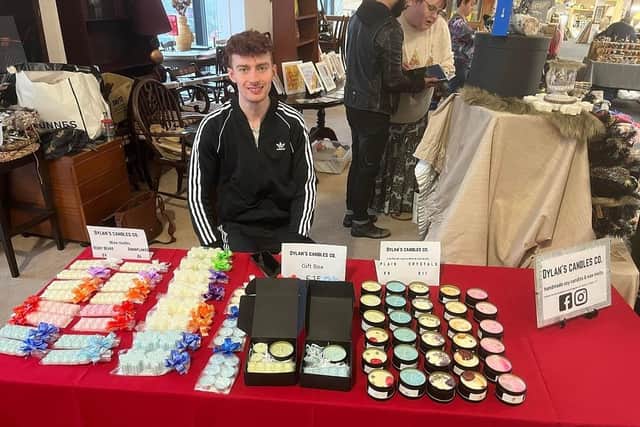 Dylan Nelson with a selection of his candles.
