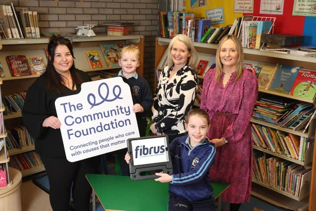 Pictured, from left, are Nicolette Campbell, Cillian Campbell, Linda McMillan (Fibrus), Cillian Campbell, Dawn Weir (Community Foundation NI). Pic: Matt Mackey