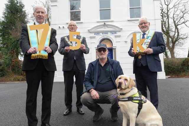 Freemasons Mal Ross, Leslie Nixon and Barry Brewster are pictured with Gary Jordan and Lexi from Assistance Dogs NI