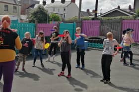 Kids practice circus skills at the Tuition Time summer scheme.