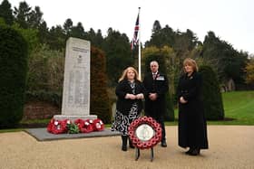 A commemorative ceramic Poppy Wreath made by prisoners in Maghaberry Prison was unveiled by Justice Minister Naomi Long at the Northern Ireland Prison Service annual remembrance ceremony to remember 32 officers who lost their lives in the course of duty. Pictured with the Minister are Beverley Wall, NIPS Director General and David Kennedy, Director of Prisons and Chairman of the Central Benevolent Fund (CBF). Pic credit: DoJ