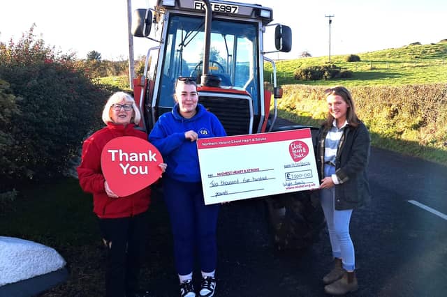 Rachel and Ruth Wright presenting a cheque to Valerie Saunders, NICHS community fundraiser. Photo provided