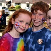 Celebrating the coronation with painted faces are, from left, Isla Speers (7), Saul Speers (10) and Annabeth Wright (9). PT18-227.