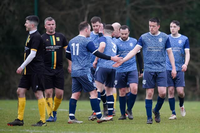 Mayobridge goalscorer Conor Garvey (second from right) is congratulated by fellow scorer Darren McPolin on Saturday.