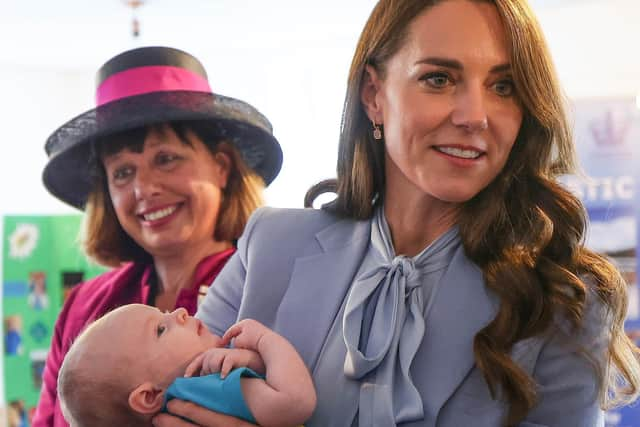 The Princess of Wales enjoys a cuddle with two-month old Isaac Railton-Minish during the visit to Carrick Connect. Picture: Jonathan Porter/PressEye