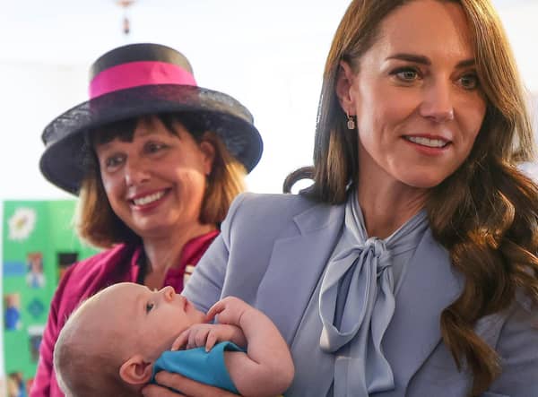 The Princess of Wales enjoys a cuddle with two-month old Isaac Railton-Minish during the visit to Carrick Connect. Picture: Jonathan Porter/PressEye