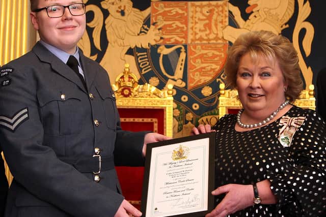 Cadet Corporal Will Patton is pictured in the Throne Room at Hillsborough Castle receiving from Dame Fionnuala Jay-O’Boyle the certificate which marks his appointment.