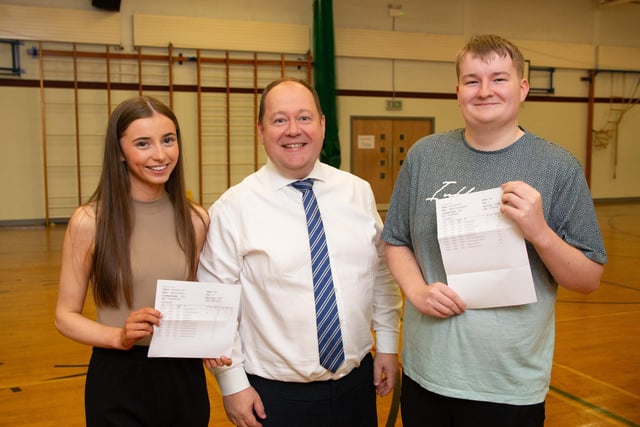 Katie Adams and Matthew McMullan celebrate their results with Principal Mr Houston.