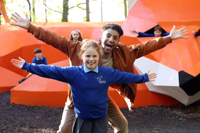 Harriet Story (Age9) from Downshire Primary School with Gyasi Sheppy, CBeebies Presenter. Pic credit: Darren Kidd