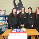 Sixth form prefects running the book fair at St Patrick's Academy