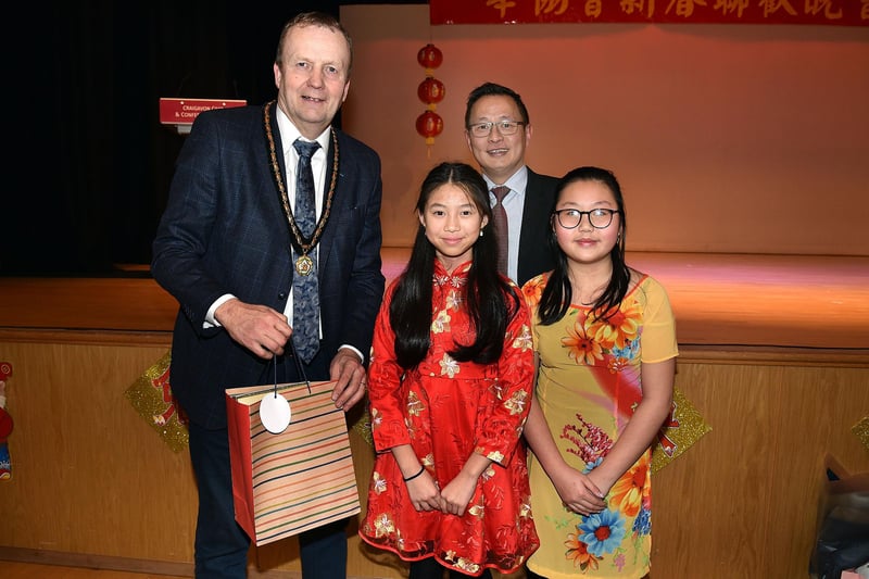 ABC Council Deputy Lord Mayor, Councillor Tim McClelland is presented with a gift by Priscilla Vong and Uni Ho during the Chinese New Year celebrations. Also included is WSah Hep Chinese Community Association director, Paul Yam. PT04-205.