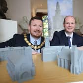 Communities Minister Gordon Lyons (centre) with Deputy Mayor of Causeway Coast and Glens Alderman Richard Brown Stewart and Joanne Honeyford, Community Engagement Officer – Museum Services, Causeway Coast and Glens Borough Council. CREDIT DFC