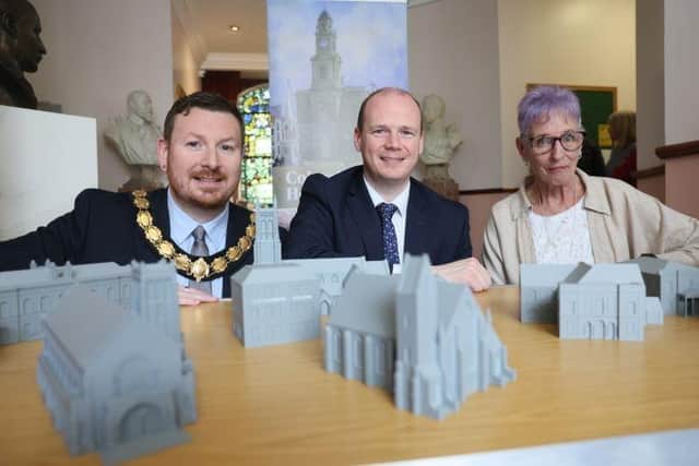 Communities Minister Gordon Lyons (centre) with Deputy Mayor of Causeway Coast and Glens Alderman Richard Brown Stewart and Joanne Honeyford, Community Engagement Officer – Museum Services, Causeway Coast and Glens Borough Council. CREDIT DFC