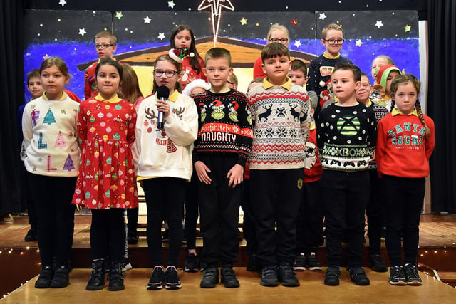 Some of the pupils of class P4S performing a poem at the  Hart Memorial Primary School Key Stage One Christmas Variety Concert. PT50-812.