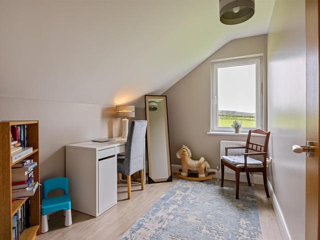 Further bedroom with Karndean flooring.