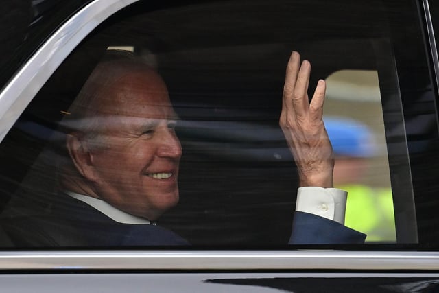 US President Joe Biden waves to the crowd as he leaves the Ulster University in Belfast. Picture: Colm Lenaghan/Pacemaker