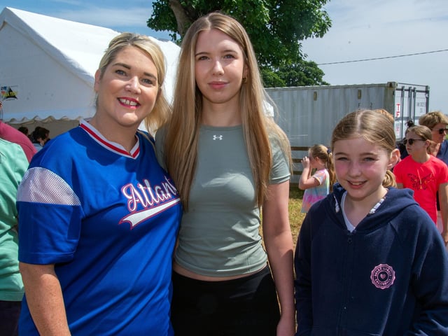 Enjoying the sun and fun at the Drumcree Parish Garden Fete are Christina and daughters, Jessica and Darcy (10). PT23-221.