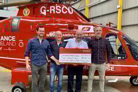 Ciaran Shevlin, Rory O'Connor, Mickey O'Connor and Ryan Donnelly donate the money raised to the Lisburn based charity. Pic credit: Air Ambulance NI