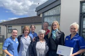 (L to R) Community Staff Nurse, Kelly Fitzsimons, Senior Health Care Assistant, Susan Jones, Community Staff Nurse, Elaine Cleland, District Nurse, Lee-Anne Dick and Senior Community Staff Nurse, Jenny White (far right). At the Front (L to R) Robert Quigg’s wife, Andrea and sister, Liz.
