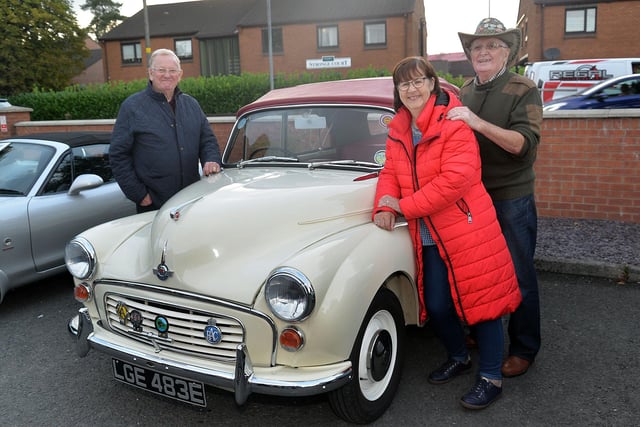 Norman Cooke, left, and Marlene and Holt McKeown pictured with a 1967 Morris Minor Convertible at the Mahon Hall vintage evening. PT36-209.