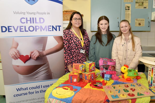 Mrs Lynsey Beattie, head of Home Economics which includes Child Development, pictured at the Craigavon Senior High School open night with prospective pupils, Jessica Irwin and Katrina Svarte. PT04-204.