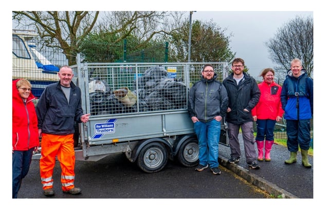 Glenise Morgan, Richard Connor, Kevin McErlean, Cllr Peter McCully, Jennifer McClelland and Nick Cumming, with the trailer full of rubbish collected from the riverbank