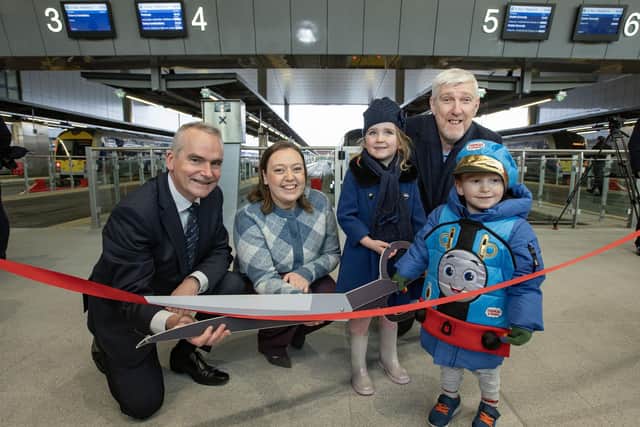 Bella Mateer from Belfast and Lorcan McGarrity from Dunmurry joined Infrastructure Minister John O'Dowd, Translink Group Chief Executive Chris Conway and Deborah Erskine, MLA, Chair of Infrastructure Committee to mark the first trains in service at Belfast Grand Central Station this morning. Picture by Brian Morrison.