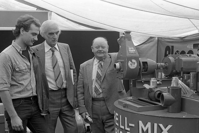 Hubert Gabbie, Crossgar, right, pictured in September 1982 at a pig fair at Greenmount, with Neill and Richard Jordan from Portadown. Picture: News Letter archives
